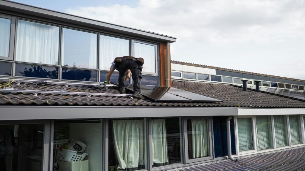 A Man Working on Solar Panels